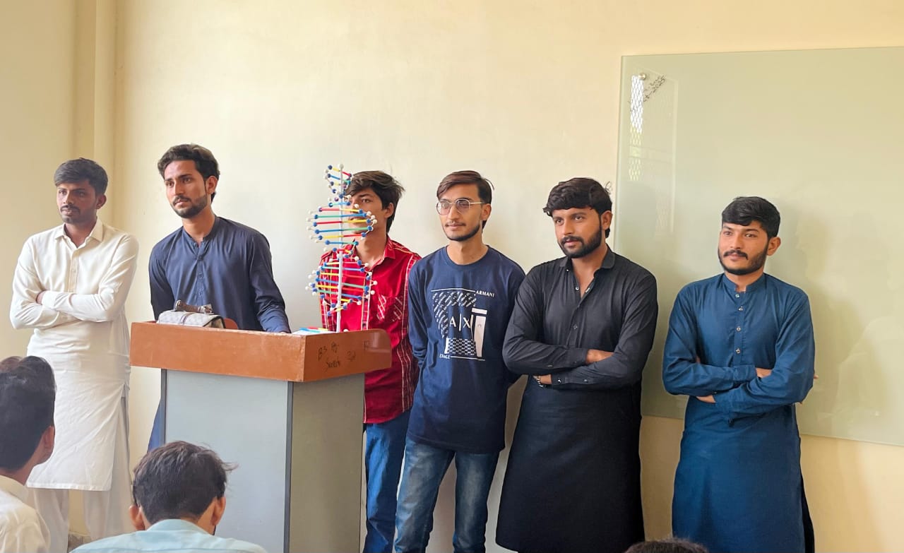 Students presenting DNA model at University of Layyah